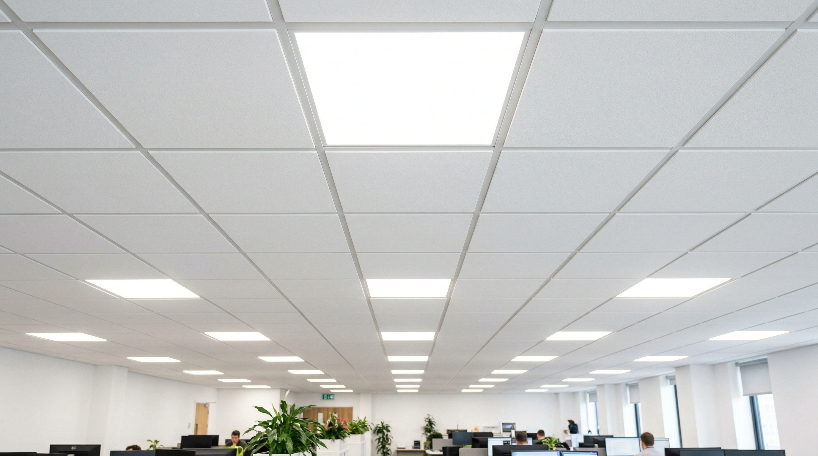 LED Panel 62x62 cm installed in a suspended grid ceiling — neutral white 4000K light, office environment