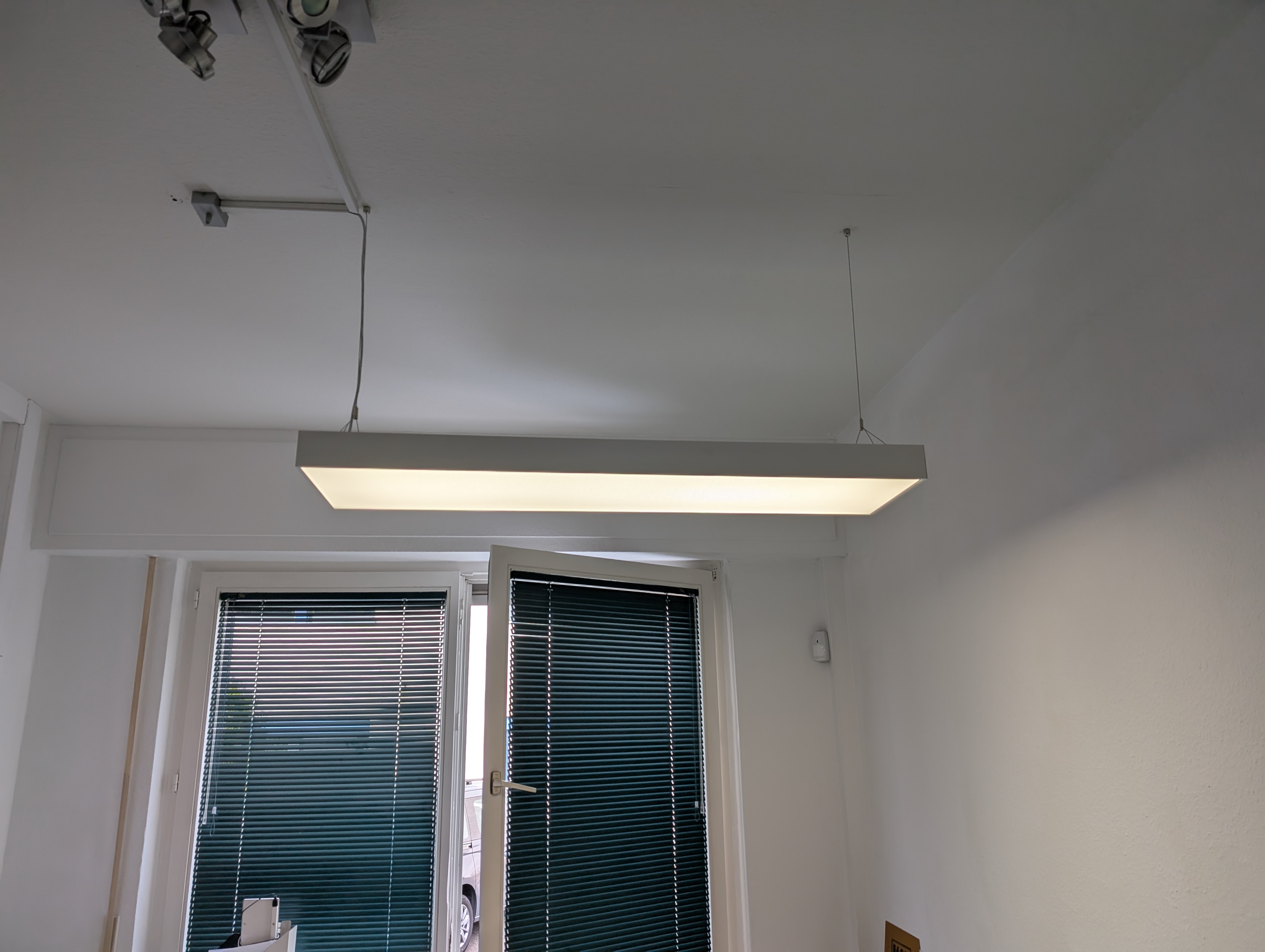 LED pendant light office – large hanging panel above desk